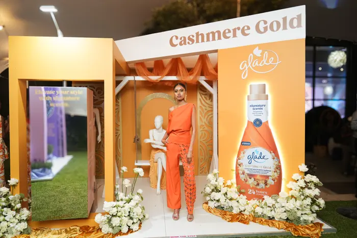 A model in a Cashmere Gold look, in a set built around the fragrance